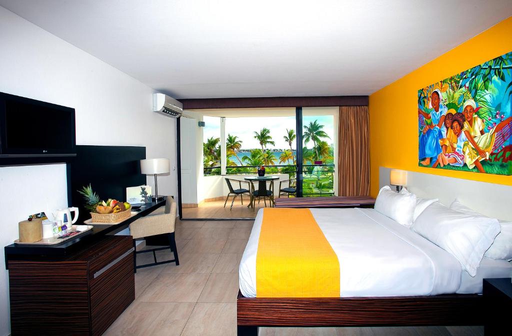Postel nebo postele na pokoji v ubytování Hommage Hotel & Residences