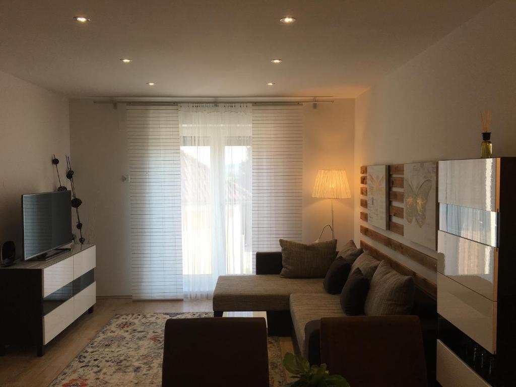 Televízia a/alebo spoločenská miestnosť v ubytovaní Haus am Wanderweg