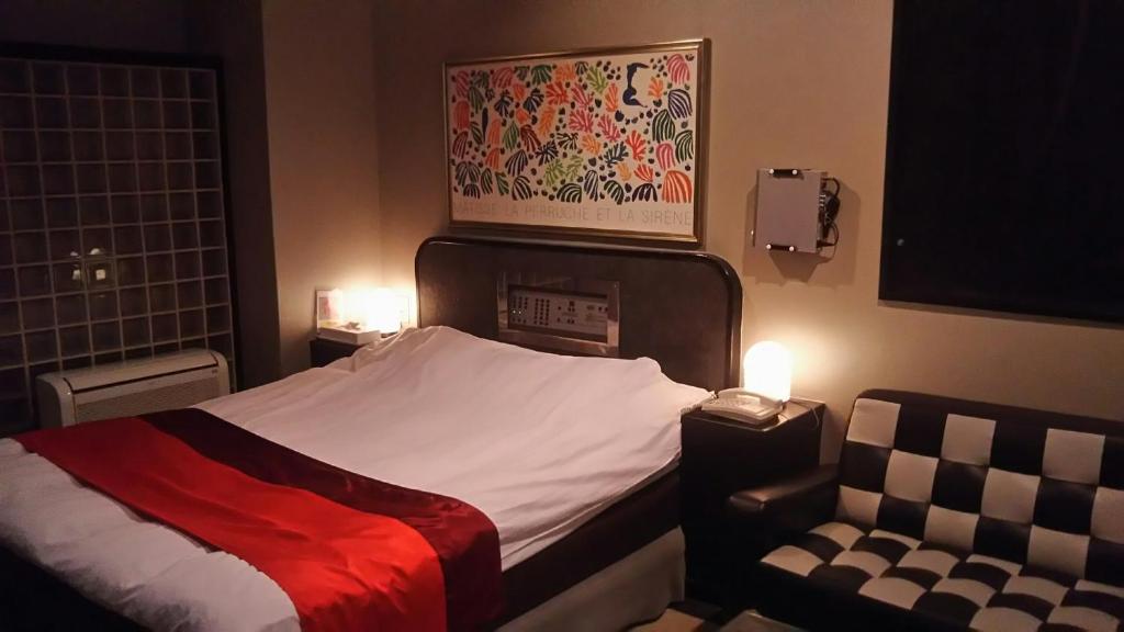 Postel nebo postele na pokoji v ubytování Hotel Sting
