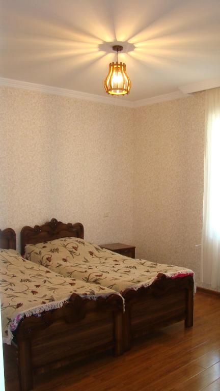 Postel nebo postele na pokoji v ubytování Guest House Tavaduri