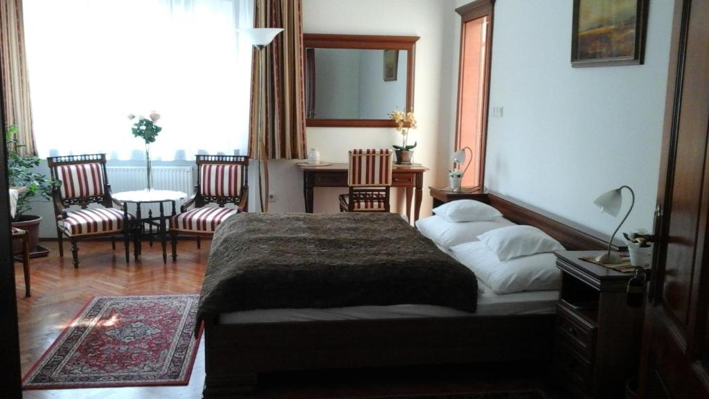 Postel nebo postele na pokoji v ubytování Villa Cecile
