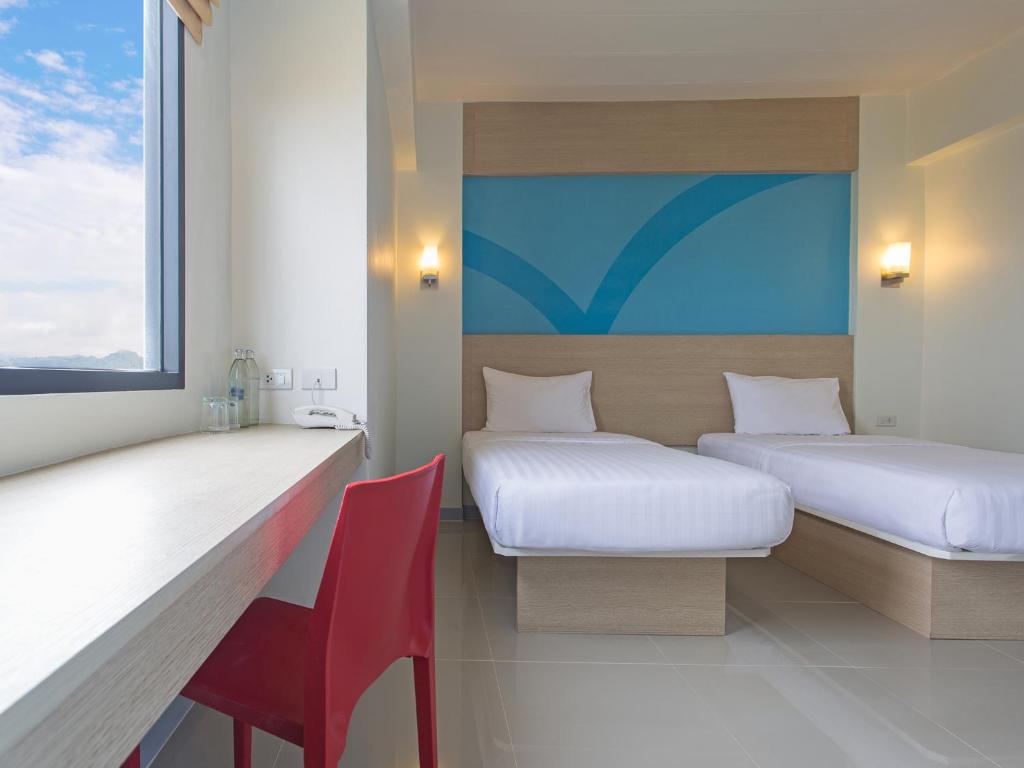 Letto o letti in una camera di HOP INN Chiang Rai