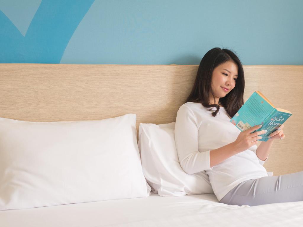 Letto o letti in una camera di HOP INN Chiang Rai