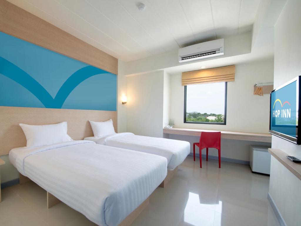 Letto o letti in una camera di HOP INN Chiang Rai