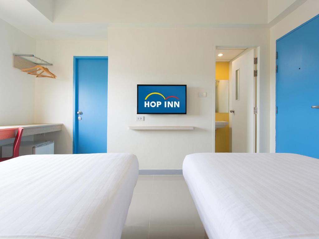 Letto o letti in una camera di HOP INN Chiang Rai