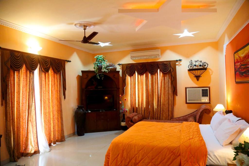 Postel nebo postele na pokoji v ubytování Hotel Goan Heritage