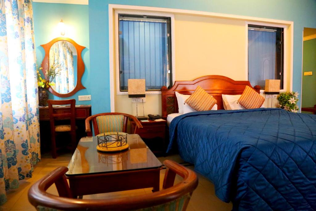 Postel nebo postele na pokoji v ubytování Hotel Goan Heritage