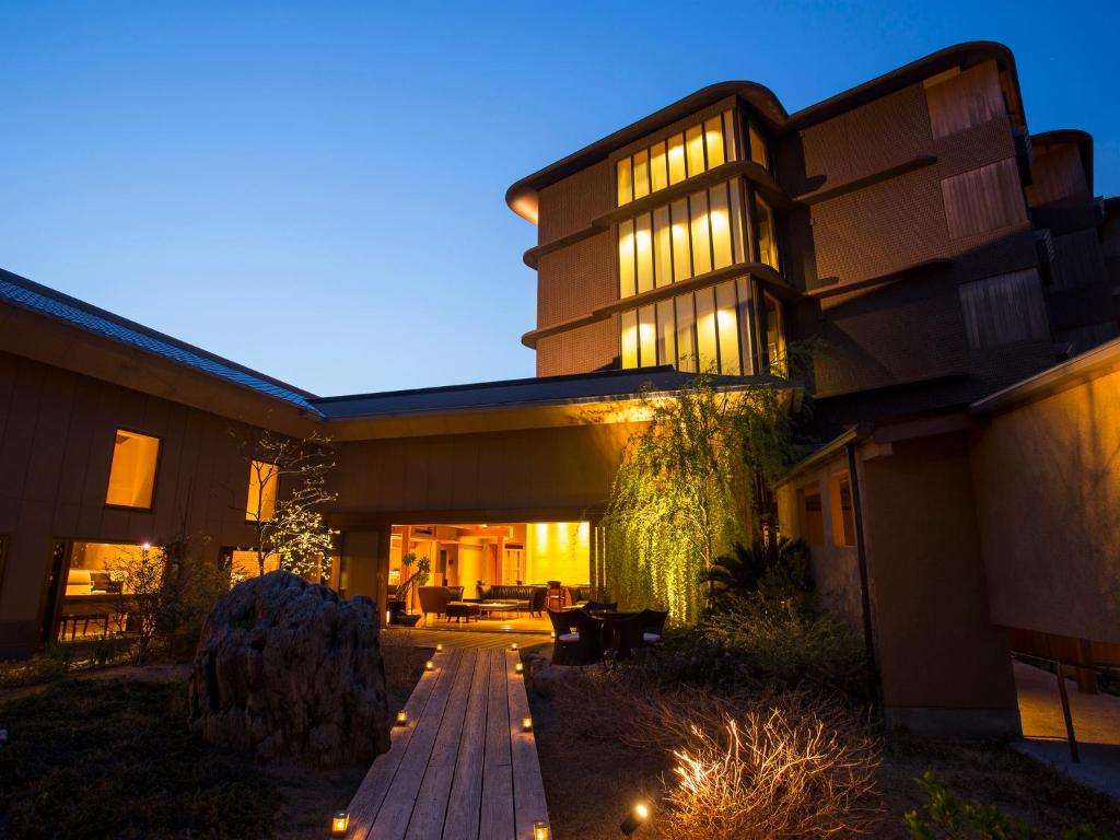 a house with a pathway leading to it at night at Amahara in Sumoto