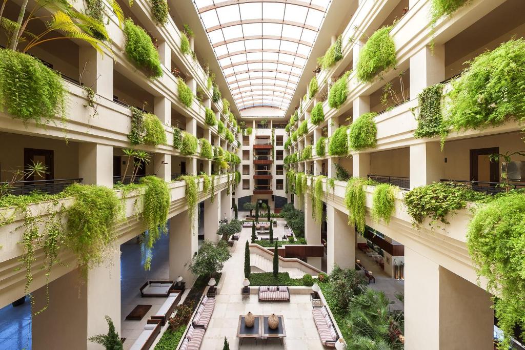 arium of a building with plants on the ceilings at Puerto Antilla Grand Hotel in Islantilla