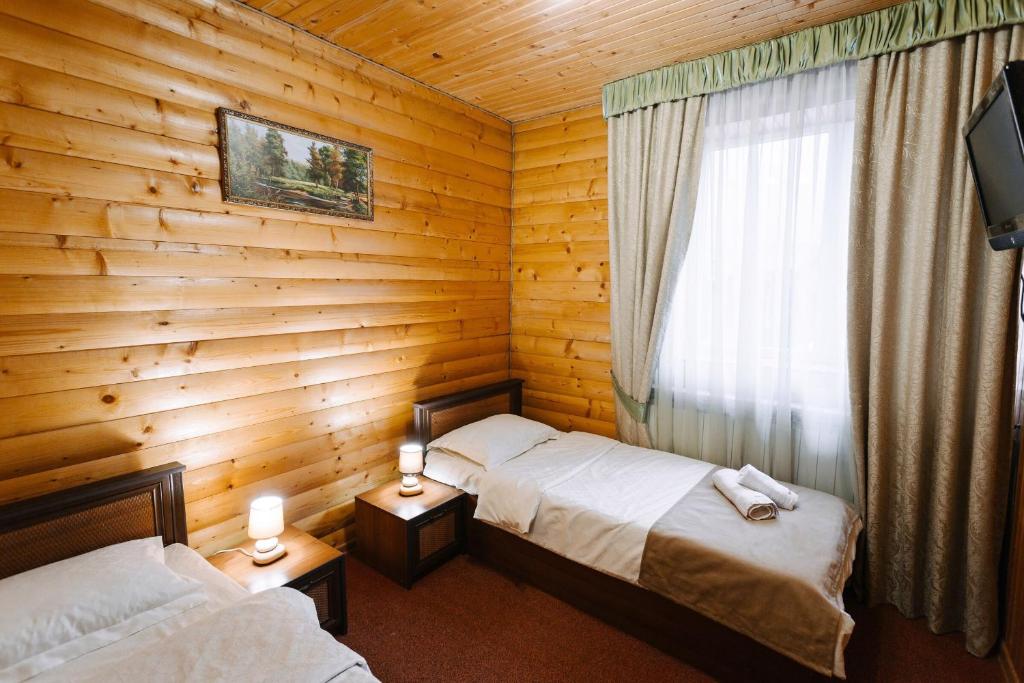 Postel nebo postele na pokoji v ubytování Hotel Marilen
