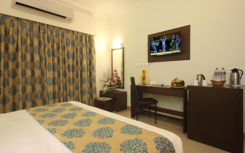 Postel nebo postele na pokoji v ubytování Hotel Goan Heritage