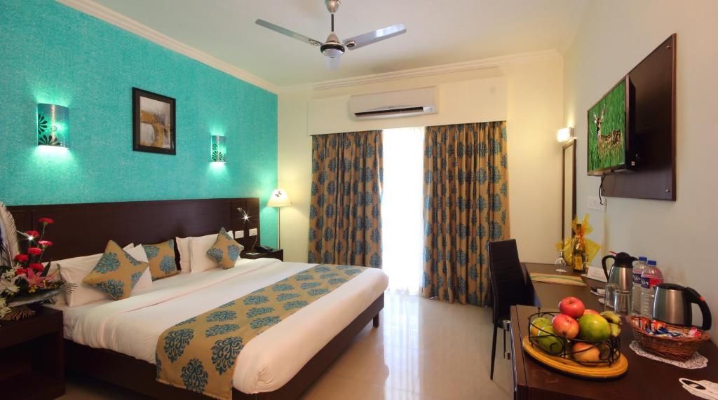 Postel nebo postele na pokoji v ubytování Hotel Goan Heritage