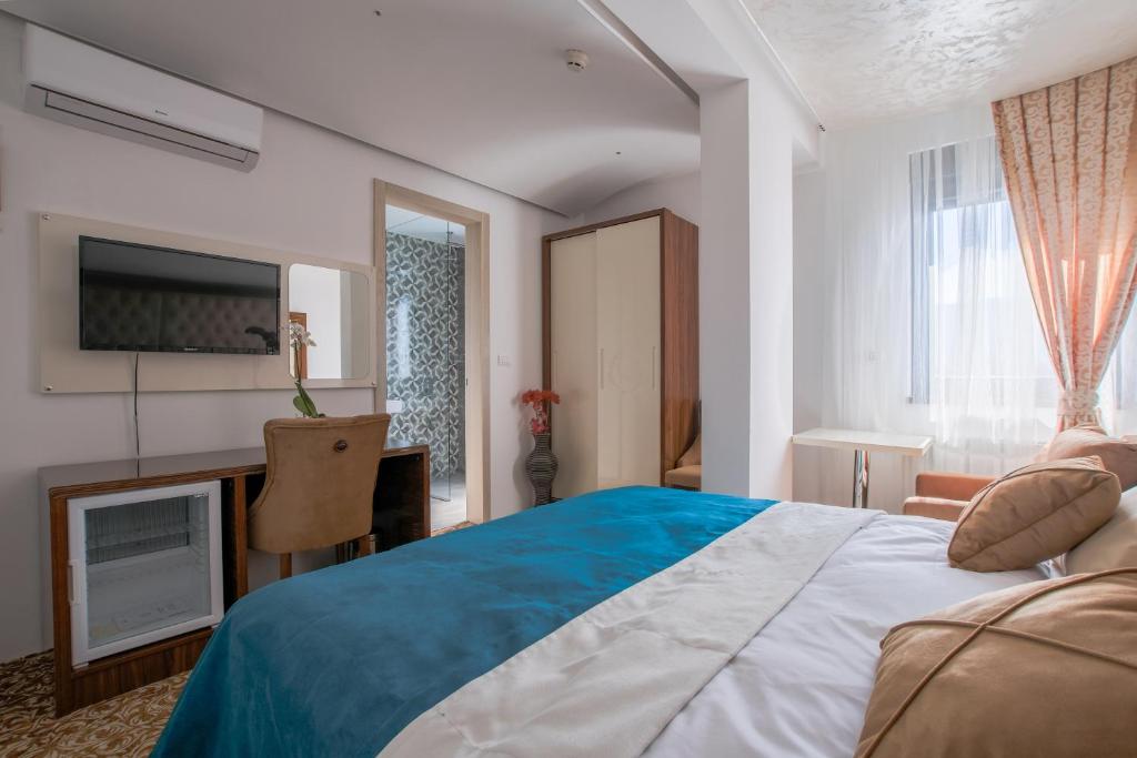 Postel nebo postele na pokoji v ubytování New Hotel