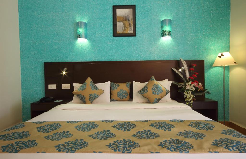 Postel nebo postele na pokoji v ubytování Hotel Goan Heritage