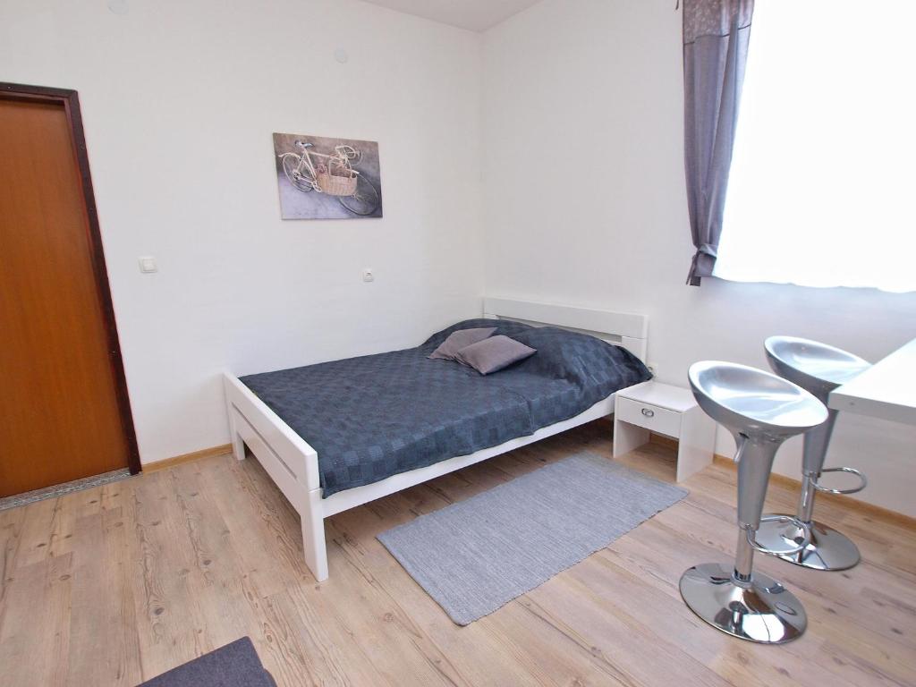 Postel nebo postele na pokoji v ubytování Apartments Drago 589