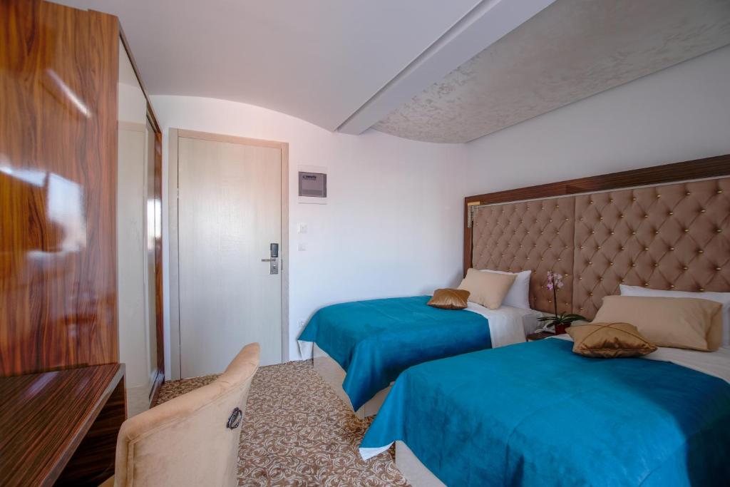 Postel nebo postele na pokoji v ubytování New Hotel