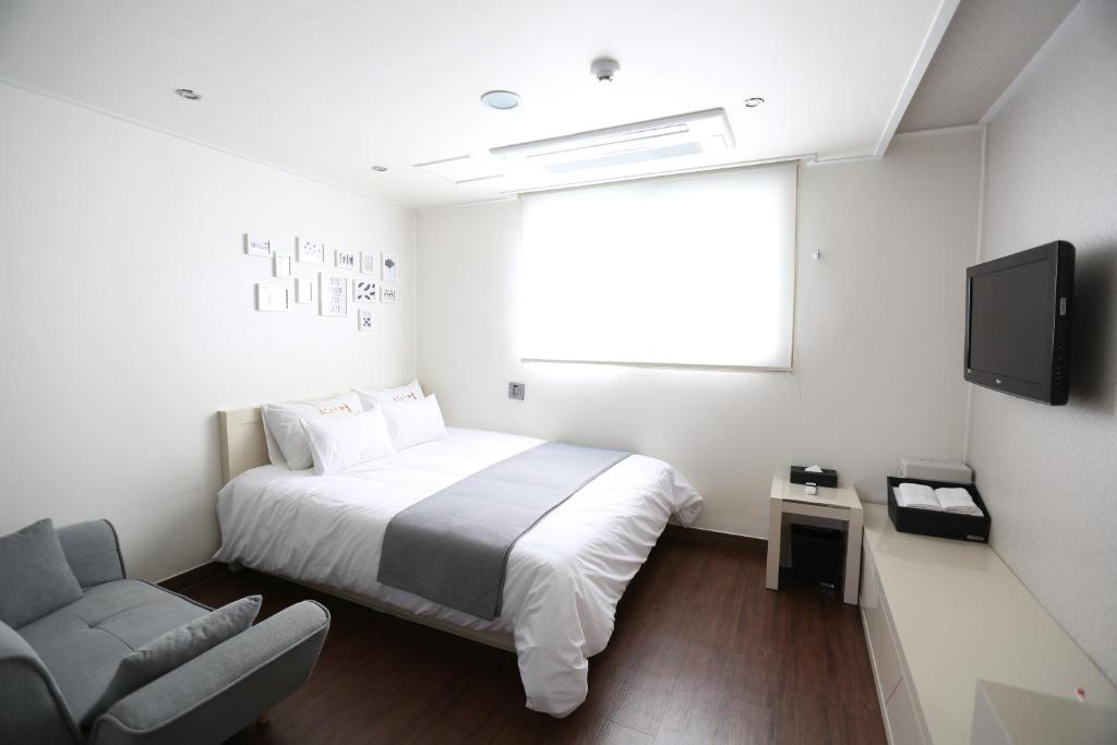 TV a/nebo společenská místnost v ubytování Residence Mumum Hotel