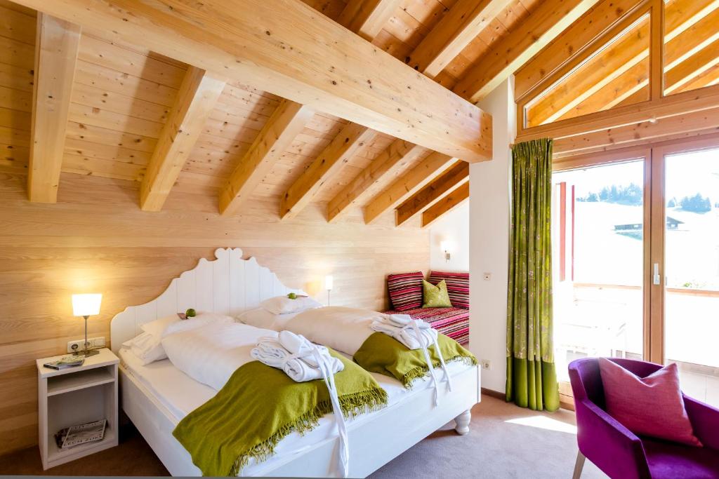Postel nebo postele na pokoji v ubytování Hotel Stäfeli