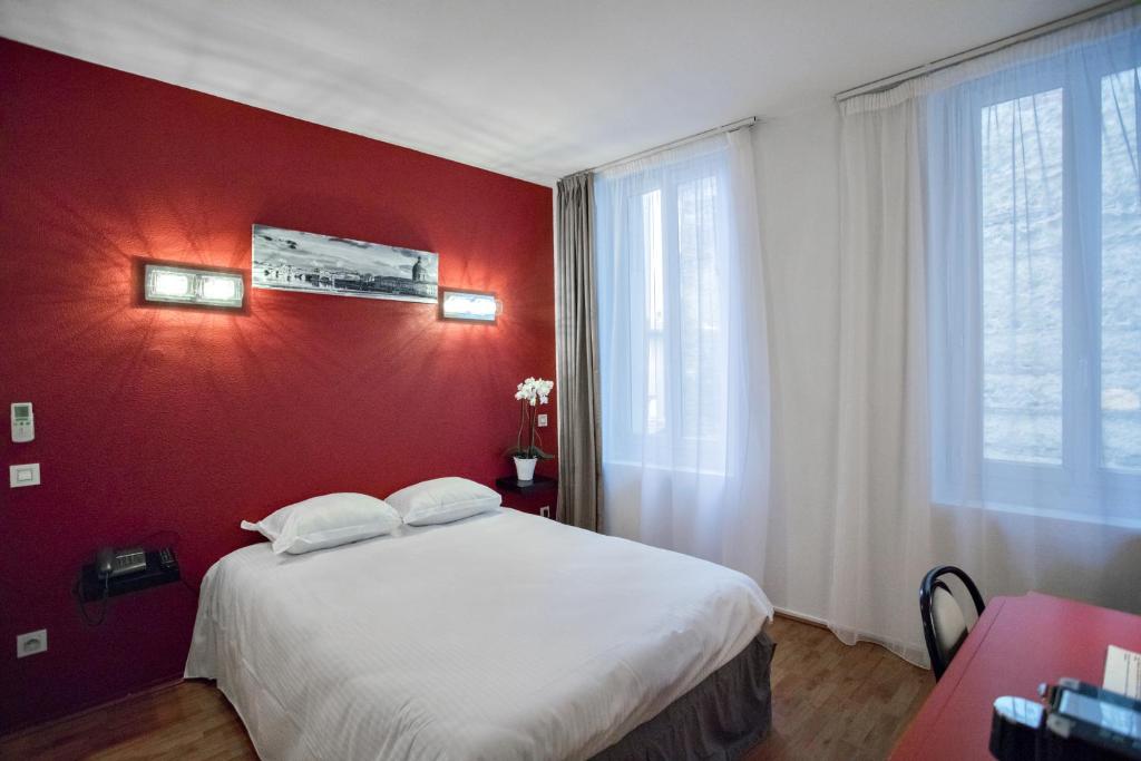 Postel nebo postele na pokoji v ubytování Occitania Centre Toulouse Matabiau