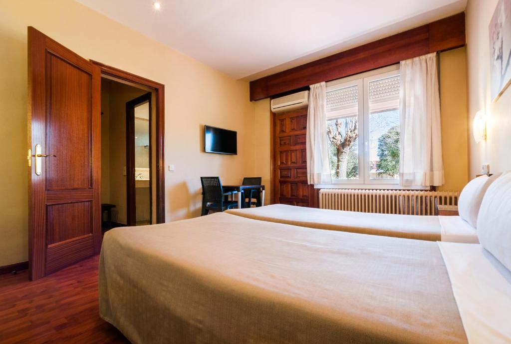 Postel nebo postele na pokoji v ubytování Hotel Los Olivos