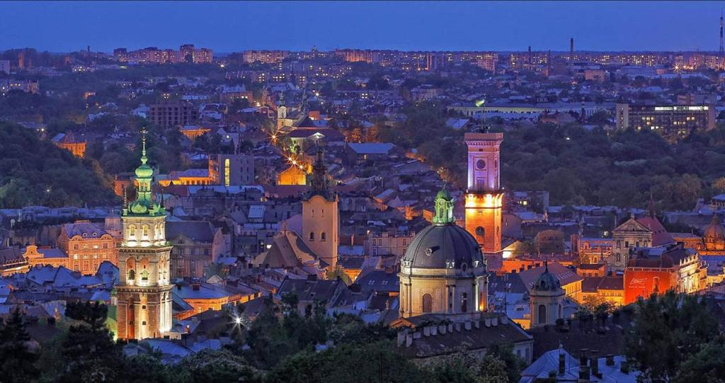 a view of a city at night at Apartment Novyj Svit in Lviv