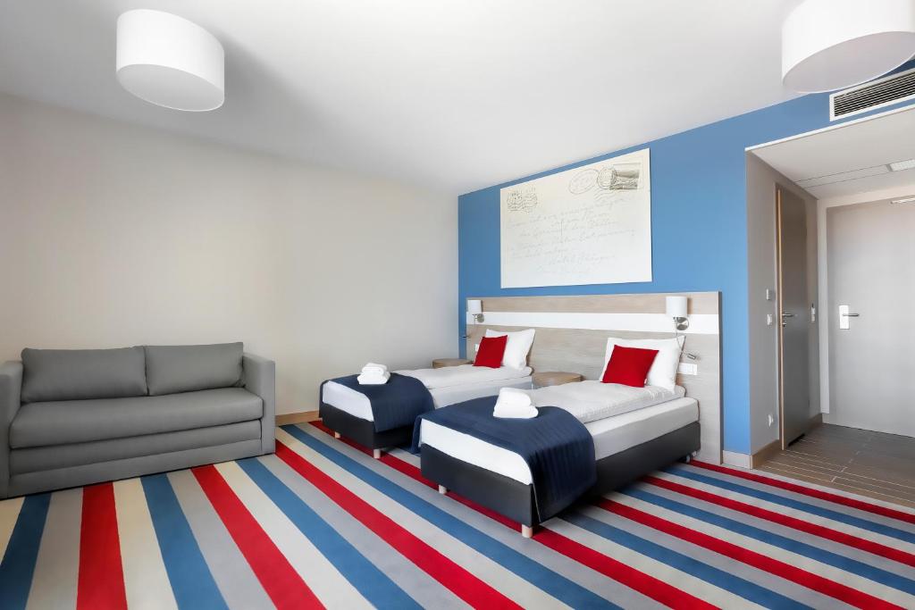 Postel nebo postele na pokoji v ubytování Hotel Skipper