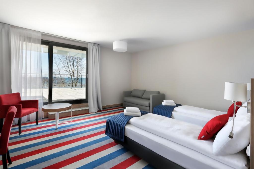 Postel nebo postele na pokoji v ubytování Hotel Skipper
