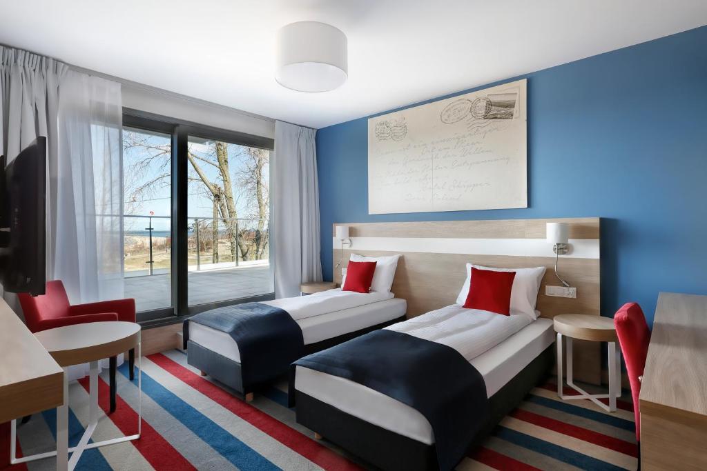 Postel nebo postele na pokoji v ubytování Hotel Skipper
