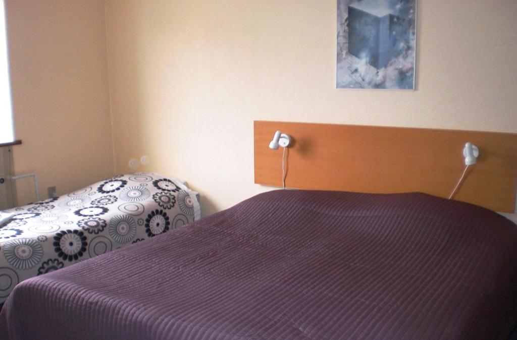 Postel nebo postele na pokoji v ubytování Hotel Kong Valdemar