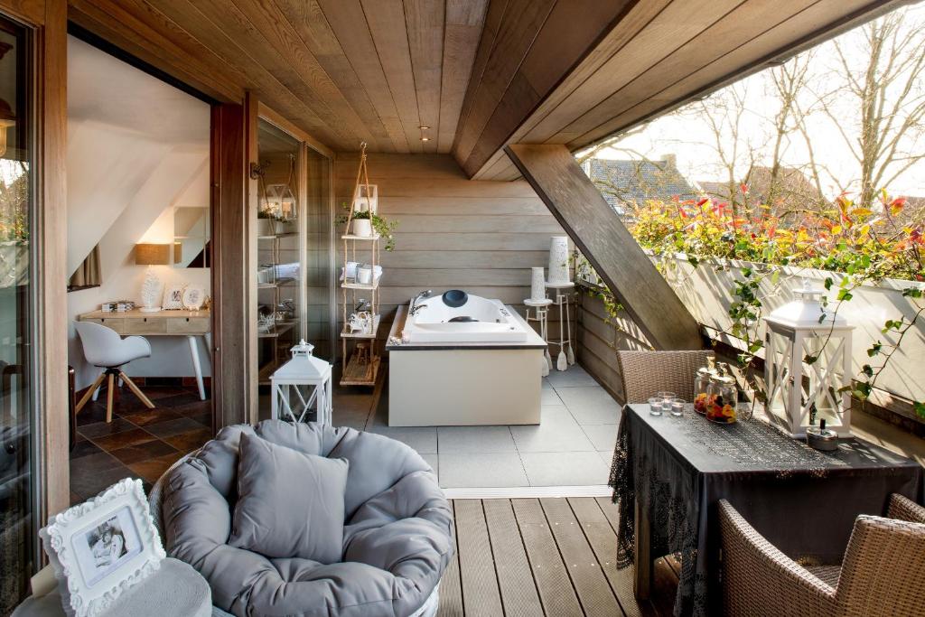 Posezení v ubytování Charmehotel Manoir Ogygia