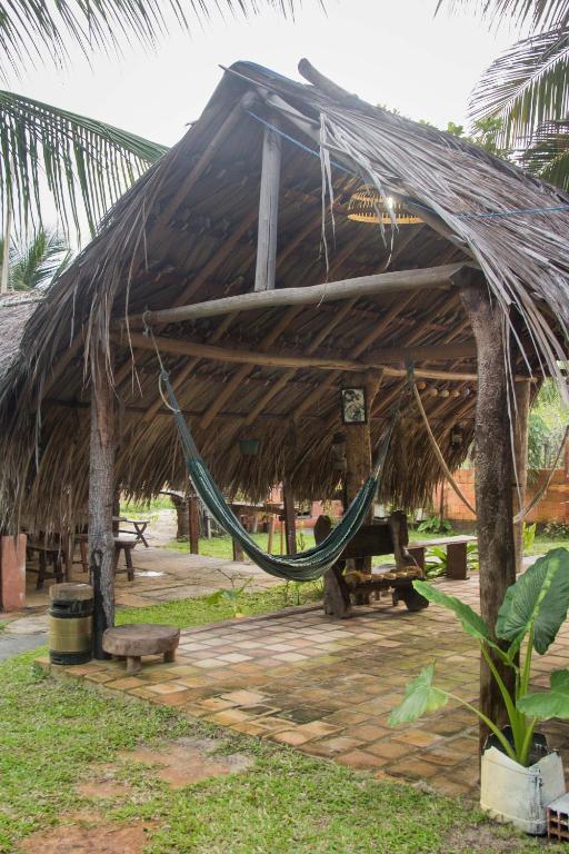 Um jardim no exterior de Pousada Mirage Atins