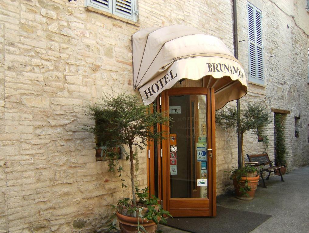 a phone booth in front of a building at Hotel Palazzo Brunamonti in Bevagna