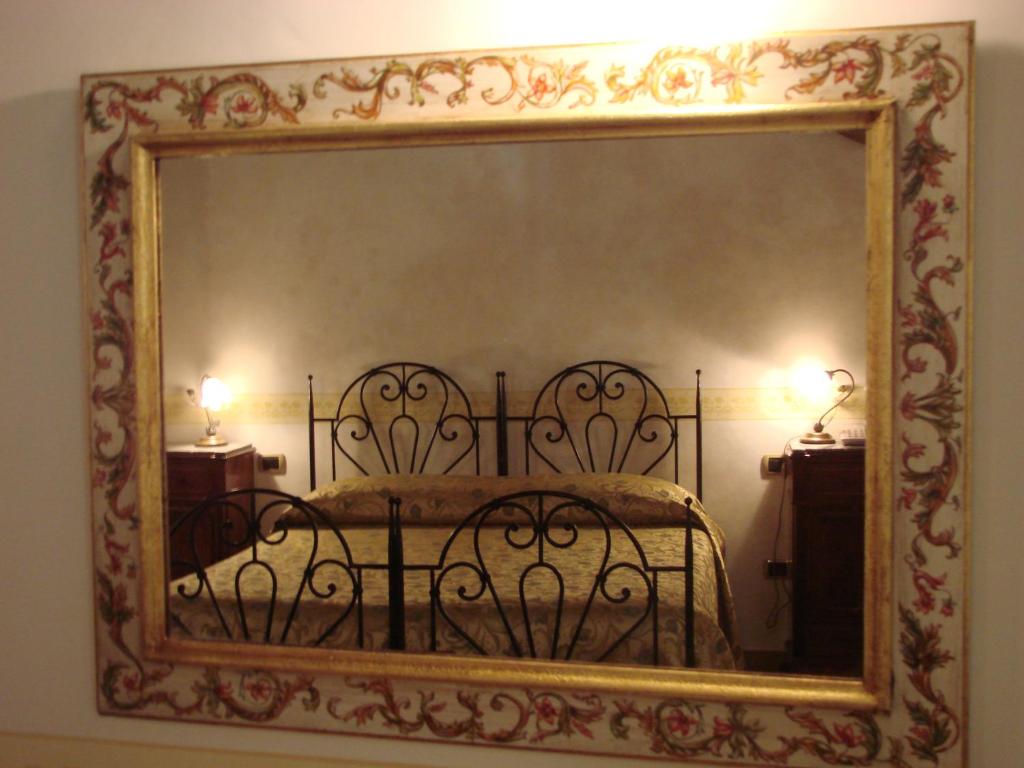 A bed or beds in a room at Hotel Palazzo Brunamonti