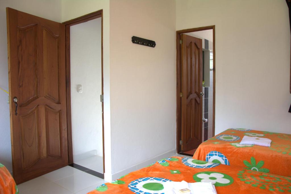 Postel nebo postele na pokoji v ubytování Hotel Internacional Jardín