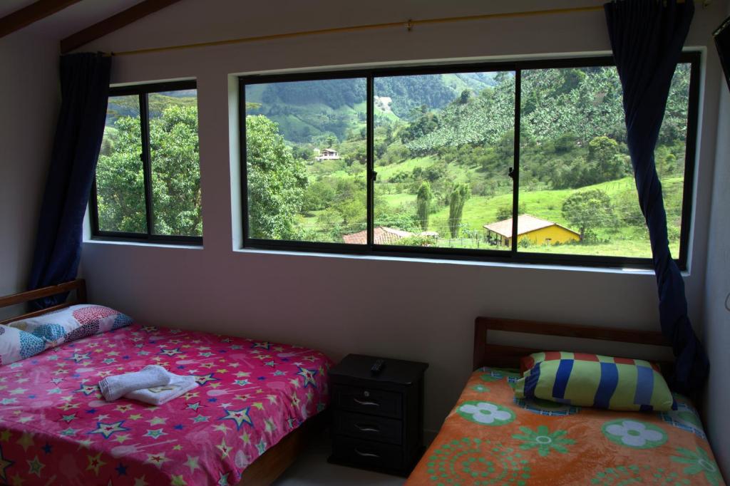 Postel nebo postele na pokoji v ubytování Hotel Internacional Jardín