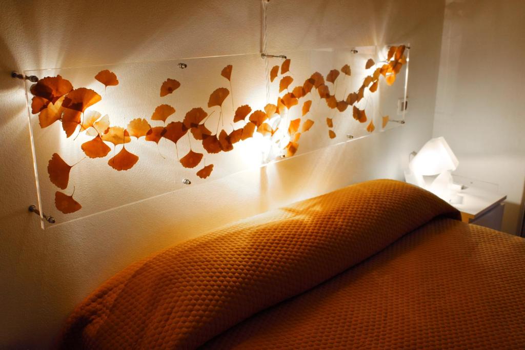 A bed or beds in a room at Cibele Bed&Breakfast