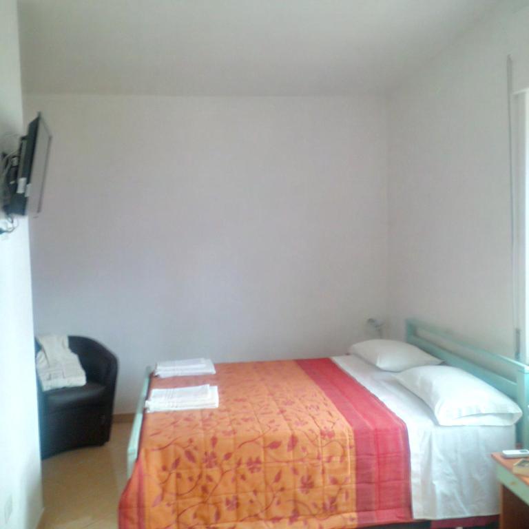 Postel nebo postele na pokoji v ubytování Hotel Maremonti