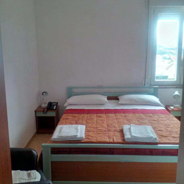 Postel nebo postele na pokoji v ubytování Hotel Maremonti