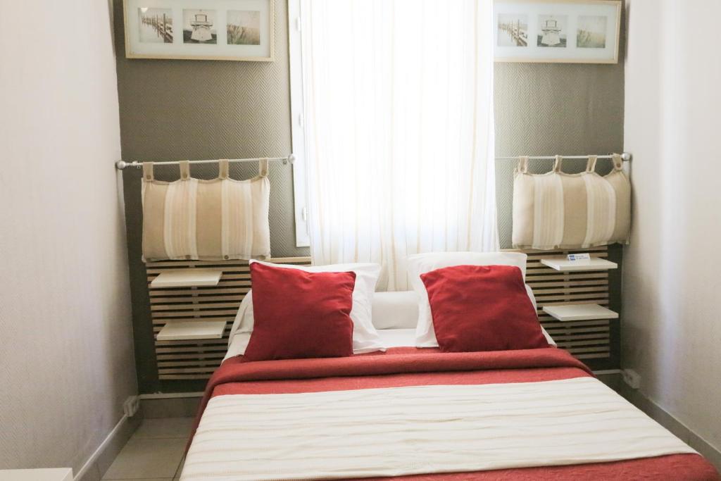 Un ou plusieurs lits dans un hébergement de l'établissement Hôtel de l'Ariana