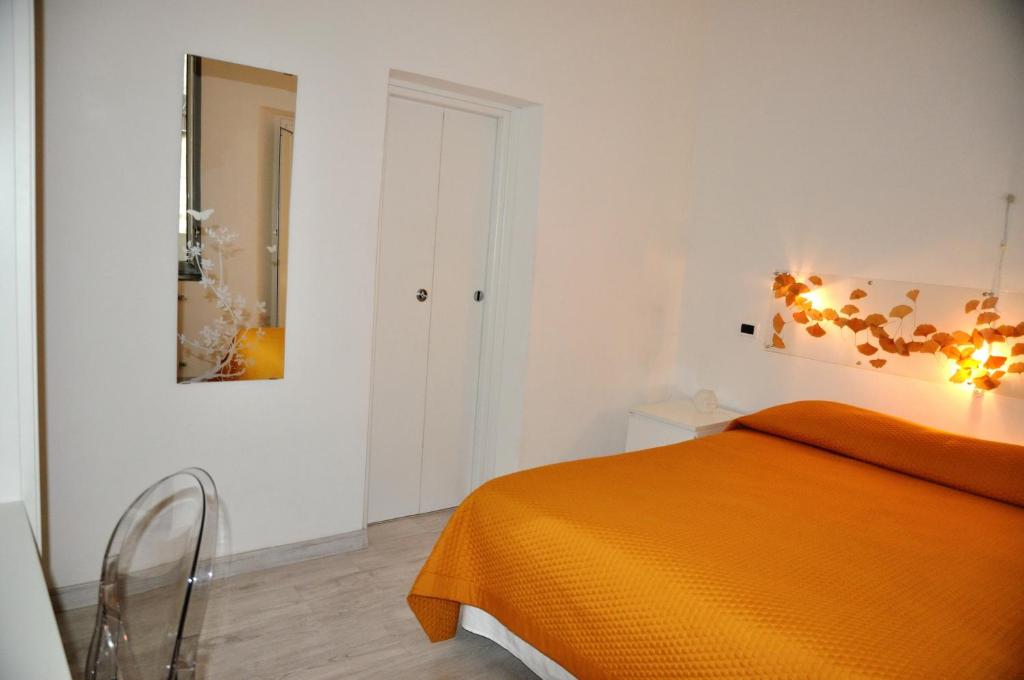 A bed or beds in a room at Cibele Bed&Breakfast