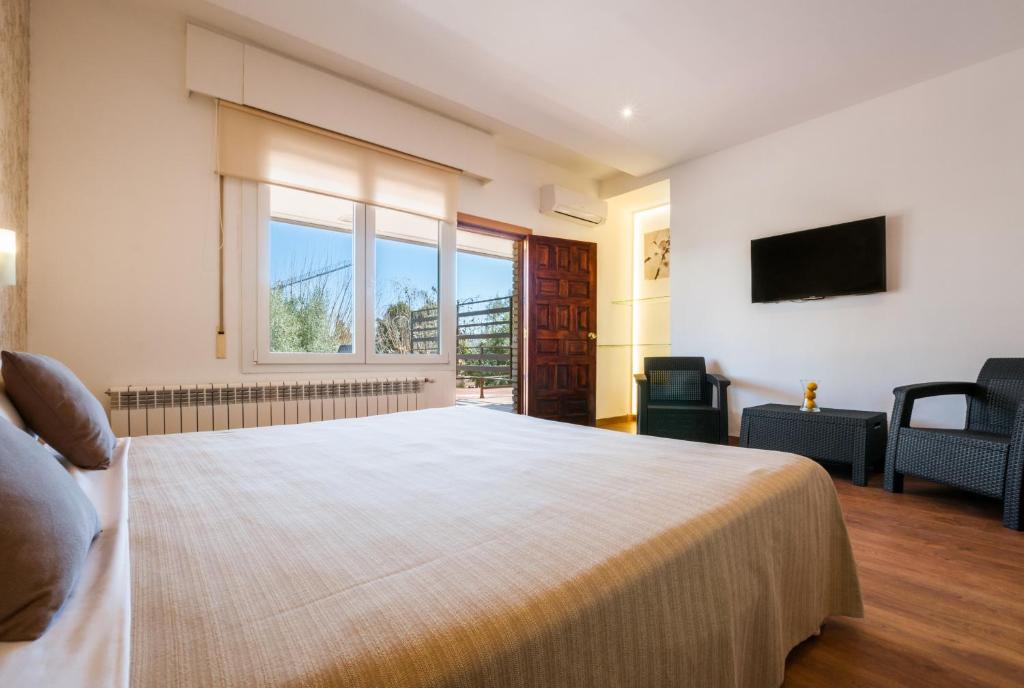Postel nebo postele na pokoji v ubytování Hotel Los Olivos