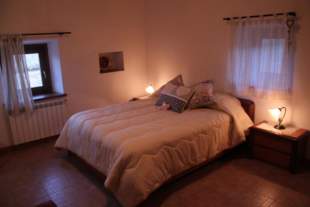 Postel nebo postele na pokoji v ubytování B&B La Pietra