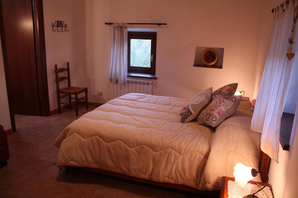 Postel nebo postele na pokoji v ubytování B&B La Pietra