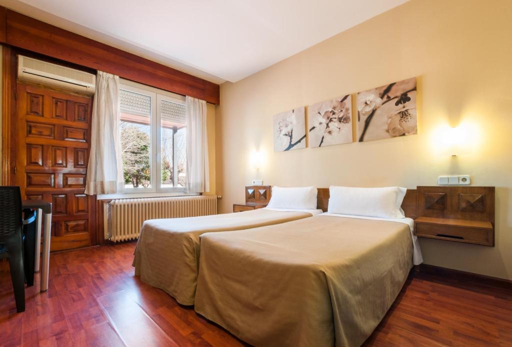 Postel nebo postele na pokoji v ubytování Hotel Los Olivos