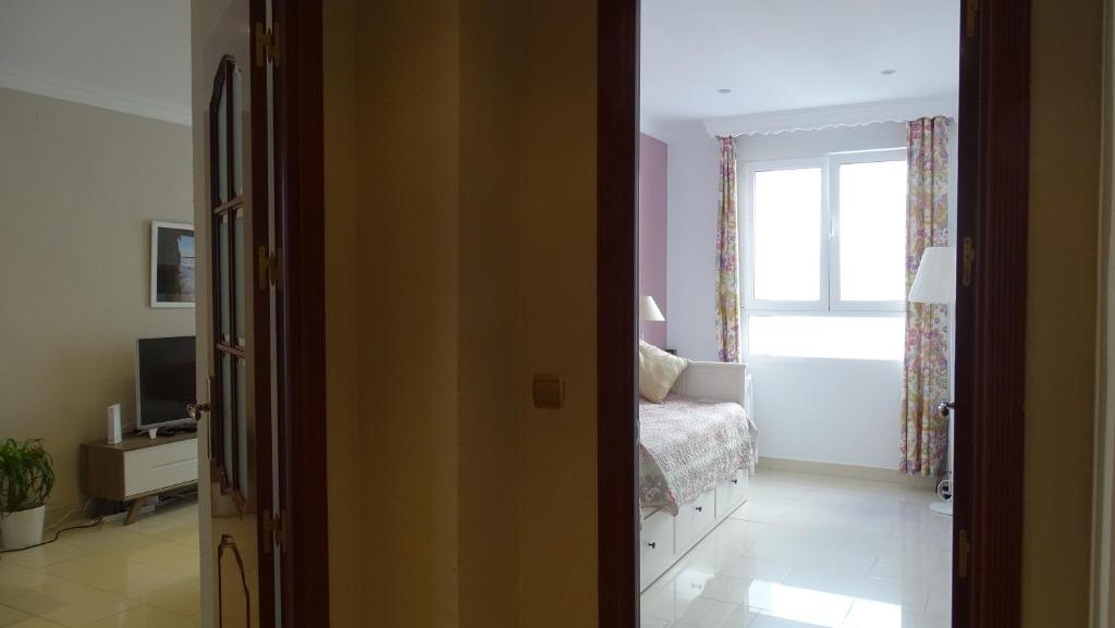 Posteľ alebo postele v izbe v ubytovaní Cosy Caleta Apartment