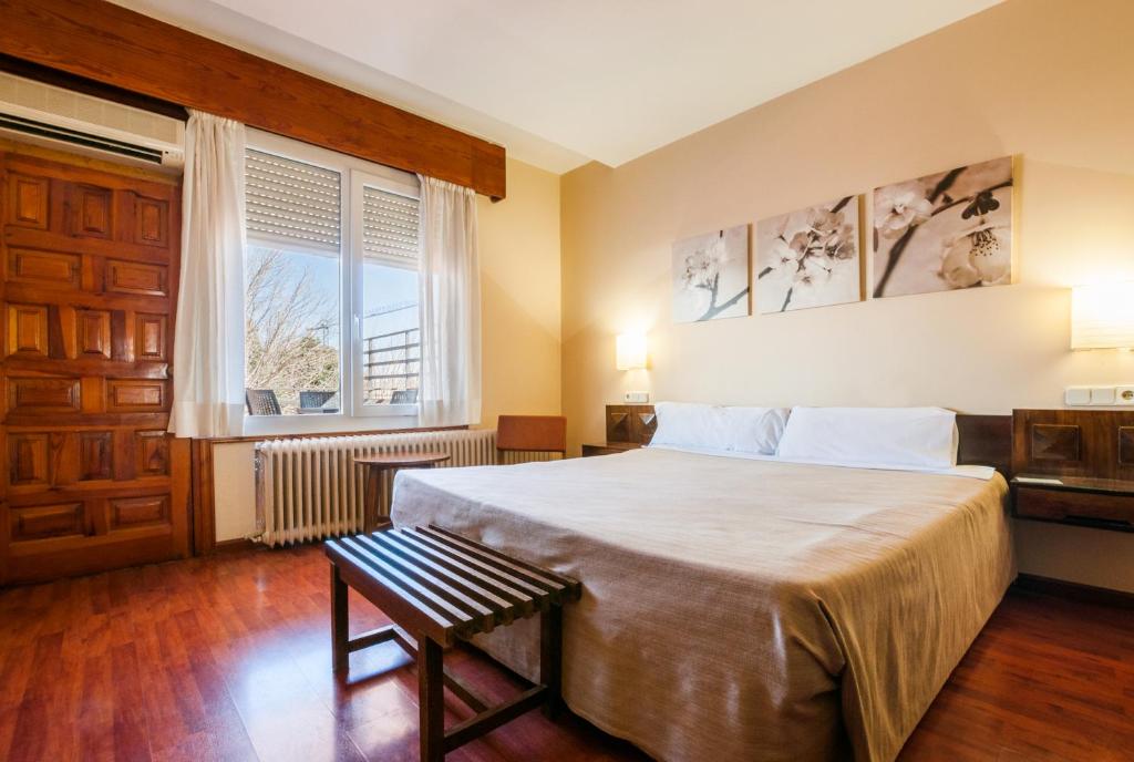 Postel nebo postele na pokoji v ubytování Hotel Los Olivos