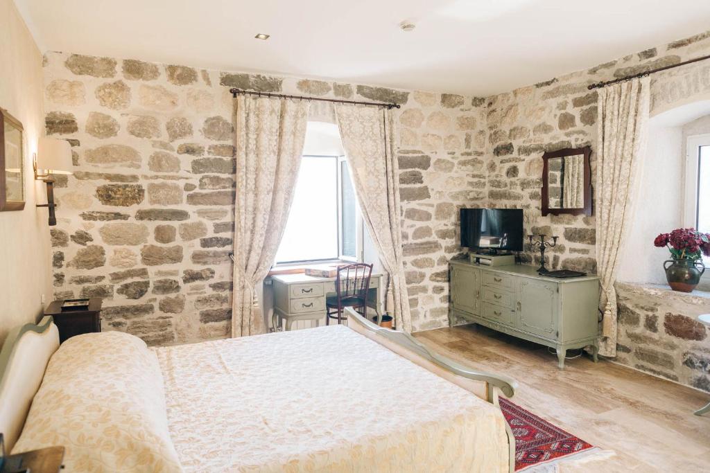 Voodi või voodid majutusasutuse Palazzo Radomiri Heritage Boutique Hotel toas