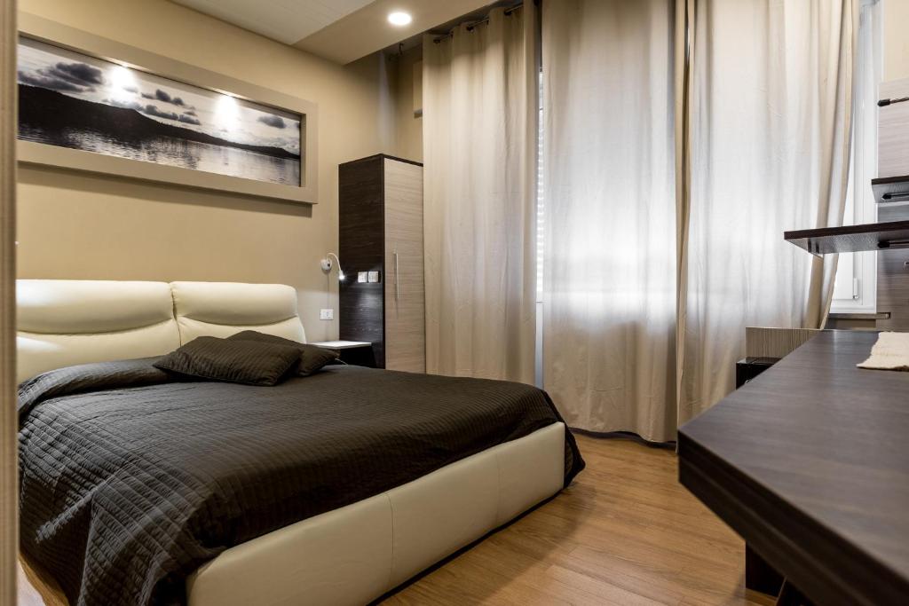 Postel nebo postele na pokoji v ubytování Hotel Royal