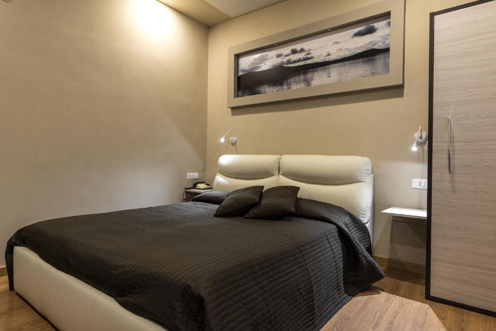 Postel nebo postele na pokoji v ubytování Hotel Royal