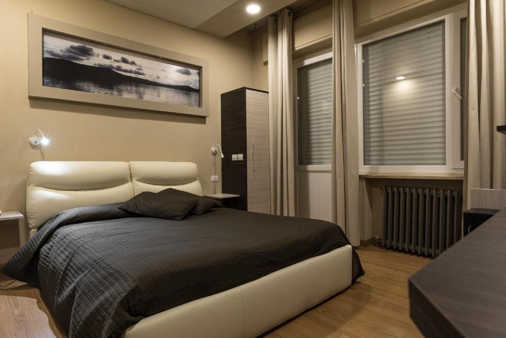 Postel nebo postele na pokoji v ubytování Hotel Royal
